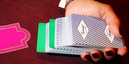Photo Of Deck Of Cards In Dealers Hand Over Table Game At The Flamingo Las Vegas