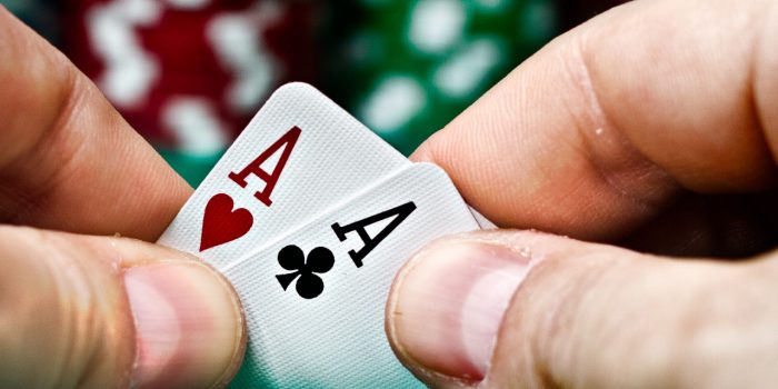 Image of Poker Hand And Casino Chips At Harrah's New Orleans Casino