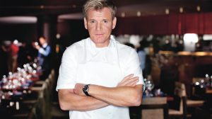 Gordon Ramsay standing inside his restaurant