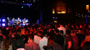 Large crowd enjoying live music and drinks at Wild Wild West