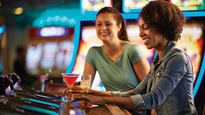 Woman playing video casino game.