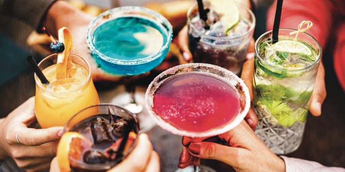 Friends toasting with cocktails