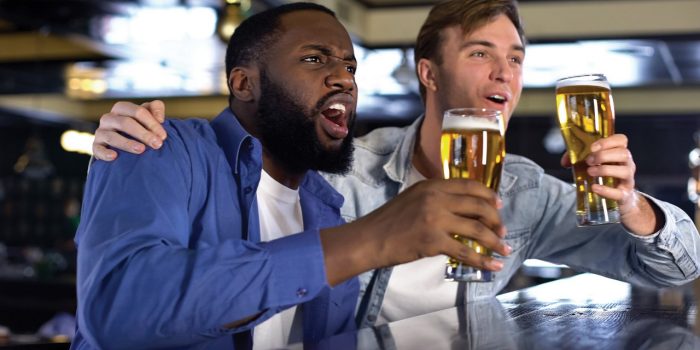 Men Cheering and drinking beer.