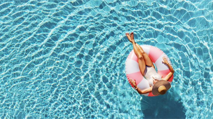 Woman flaoting in a pool