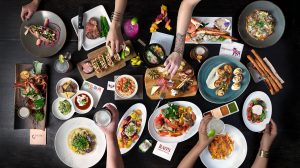 Caesars Entertainment dining options showing many plates of food