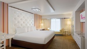 Interior view of room with king size bed and view of the strip