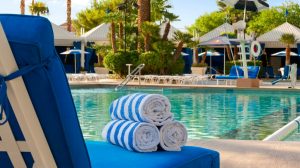 View Of Pool Showing Lounge Chairs With Rolled Towels And Cabanas Located At Bally’s Las Vegas