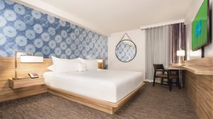 Photo Of The Pool During The Day With Guests Swimming And Lounging And The High Roller In Back Ground At The Linq Las Vegas