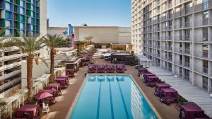 Overhead view of cabanas, pool, and palm trees at Harrah's Pool