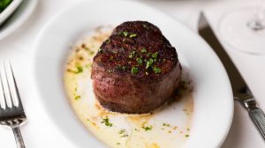 Plated steak on a table at Ruth's Chris Steak House Harrah's Las Vegas