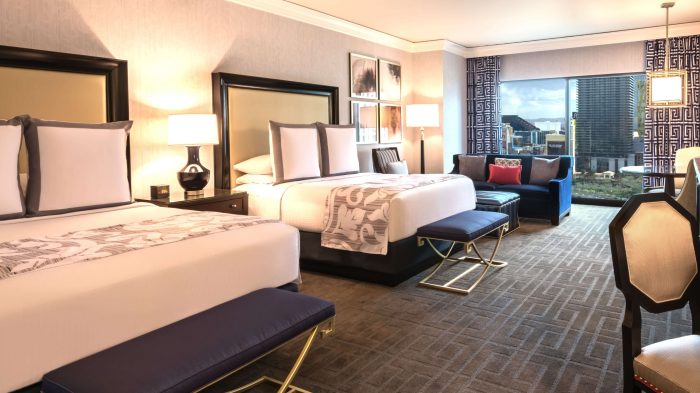 Interior view of room with 2 queen beds and view of the city