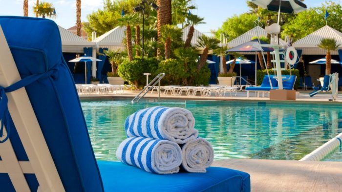 View Of Pool Showing Lounge Chairs With Rolled Towels And Cabanas Located At Bally’s Las Vegas