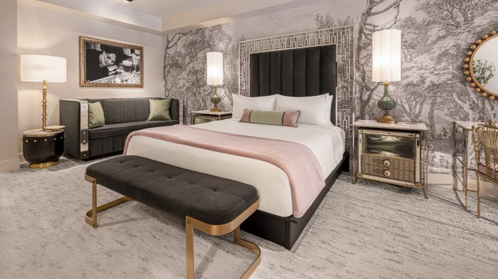 Queen bed in a hotel room at The Vanderpump Hotel
