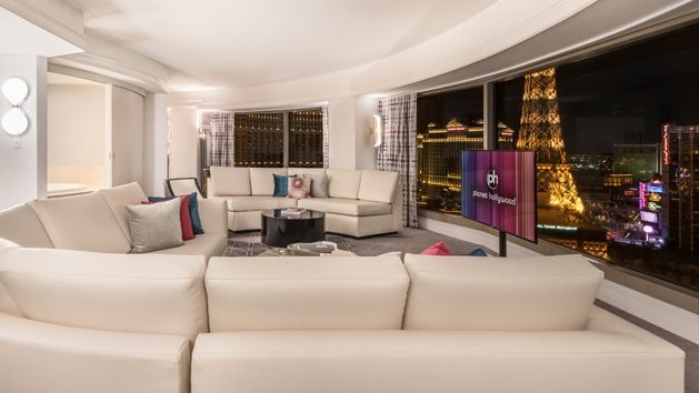 Photo of Sofas, Coffee Table, TV, And Window With View Of The Strip At Planet Hollywood