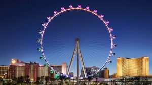 Full view of the High Roller and city scape at dusk.