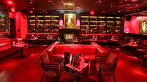 16:9 View Inside Drais After Hours Lounging Area Showing Booths, Tables, And Chairs