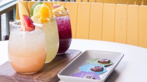 Three cocktails and chocolates.