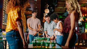 Group of friends playing beer pong at O'Shea's