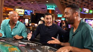 3 men playing digital table games