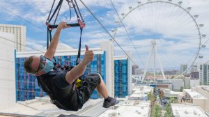 Man flying on the Fly Linq wearing a mask.