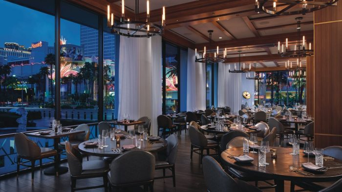 The view out the windows and the dining tables in Hell's Kitchen restaurant Caesars Palace Las Vegas