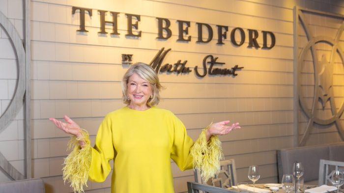 Martha Stewart standing in front of The Bedford sign