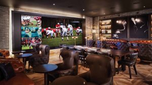 Interior View Of The Montecristo Cigar Lounge Showing Large TV's, And Cushioned Seating With Tables Inside Caesars Palace Las Vegas