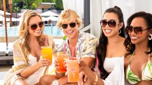 Group of people toasting drinks in a cabana at the Go Pool at Flamingo Las Vegas