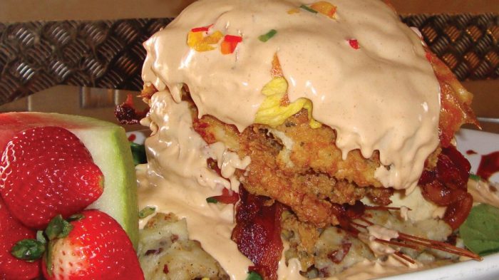 Hash House a Go Go Chicken Benedict with strawberries and watermelon