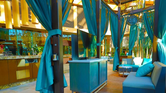 Seating and TV in bungalow at The Pool