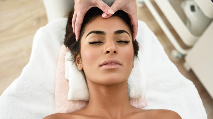 Woman on a treatment table getting a massage.