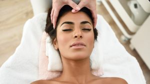 Woman on a treatment table getting a massage.