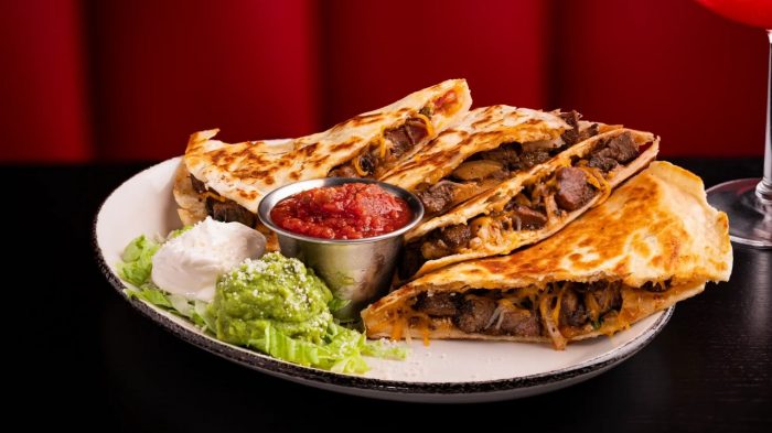 Sizzle & Salt Steak Quesadilla with guac, sour cream, and salsa