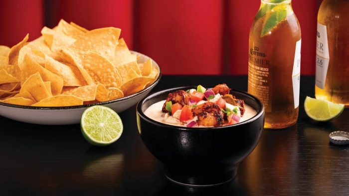Sizzle & Salt white queso and chips with beer