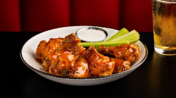 Sizzle & Salt Mango chicken wings and celery
