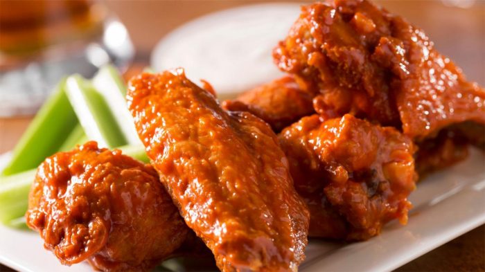 Buffalo Wings with Celery and Ranch on a plate.