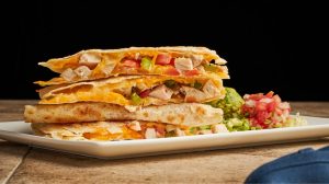 Quesadilla with guacamole and pico de gallo.