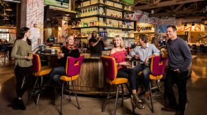 People sitting at the bar and visiting at El Jefe's Cantina.