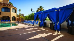 Daybeds with umbrellas on the pool deck at Harrah's Laughlin
