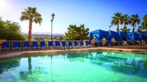 Daybeds with umbrellas on the pool deck at Harrah's Laughlin