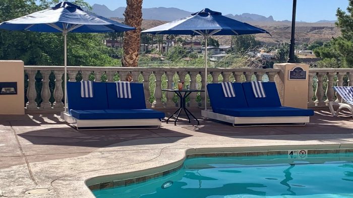 Daybeds with umbrellas on the pool deck at Harrah's Laughlin