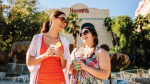Ladies with drinks at the pool.