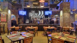 Interior of Brew Brothers with stage and dining area.