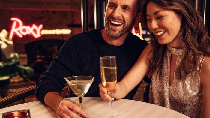 Couple drinking champagne at Roxy's