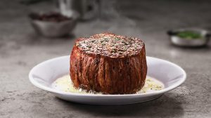 Filet on a plate with melted butter. Filet on a plate with melted butter.