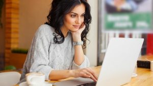 woman browsing the internet at a cafe