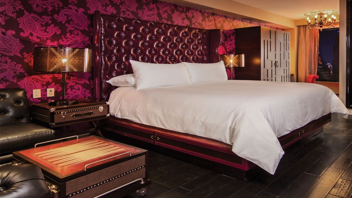 King room with couch and glamorous decor.