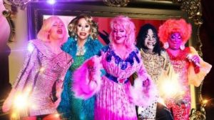Image of a group of Drag Queens in colorful attire and impersonating celebrity divas
