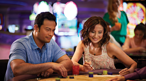 Couple playing table games at Harrah's