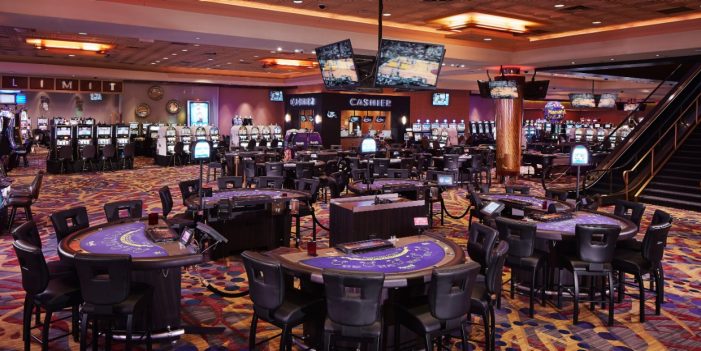 View Of Gaming Tables, Flat Screen TV's And Cashier Booth Inside The Casino At Harrah's North Kansas City